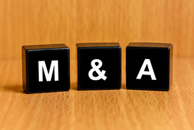 M&A on wood background